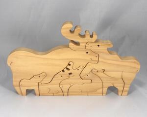 Handcrafted wood moose family stacking puzzle, ideal for children of all ages. Created in a traditional Toymakers Shop using woodworking tools, each piece is meticulously sanded and finished for lasting beauty and durability.