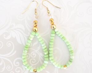 Handmade green opal beaded dangle earrings, with gold crystal accents.