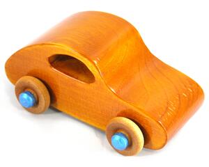 A handmade wooden toy car modeled after the iconic 1957 bug, finished with amber shellac and metallic sapphire blue trim. It's part of my Play Pal Collection.