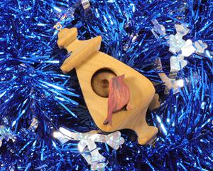 Handmade Wood Birdhouse Ornament Collectable Christmas Tree Ornament shapeed like a Christmas tree. Made from select-grade hardwoods, hand-sanded, and finished with a custom blend of oils and waxes using traditional woodworking tools.