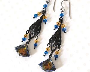 Black brass dangle earrings, with two tone blue and topaz glass and crystals.