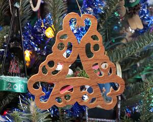 The Snowflake Ornament is a unique and special gift for the holiday season. It is a handmade wooden decoration perfect for adding a rustic touch to your Christmas tree or as a stocking stuffer. The ornament is made from upcycled and recycled wood, making it an environmentally friendly option for those who care about sustainability.

Approximate Size: 4x4 Inches

All the items I create are handmade using natural wood and wood products. Each piece is unique and may vary in appearance from one item to the next. The item you receive may differ slightly from the item pictured in the listing photos. The thickness of the wood used in your item may also vary slightly from the size specified in the listing.

It's important to note that the natural variations in wood grain, color, and knots make each piece one-of-a-kind and add to the item's character and charm. The variations should be expected and are not considered defects. If you have any concerns about the variations or would like to request a specific look or size, please contact me before placing your order, and I will do my best to accommodate your request.

Handmade in Tallahassee, Florida, USA