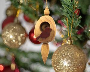 This is a light beige wooden birdhouse ornament shaped like an egg with an icicle-shaped elongated base. A small, dark reddish-brown bird is perched outside the birdhouse door. The wood grain and texture are visible.