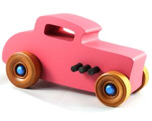 This is a handmade wooden Hot Rod '32 Deuce Coupe toy car. It is hand-painted hot pink with black and metallic sapphire blue trim. The hardwood wheels are finished with nonmarring amber shellac.