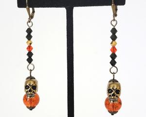 Halloween skull dangle earrings, with black and orange crystals.