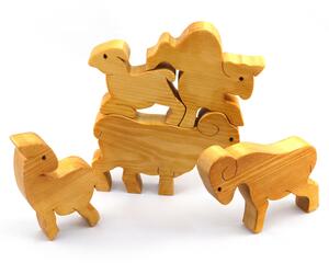 Handmade wooden toy stacking puzzle with five freestanding goats finished with a custom blend of nontoxic oils and waxes.