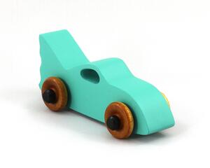 Handmade wooden toy car painted green with black trim and nonmarring amber shellac finished wheels, Part of my Play Pal Collection.