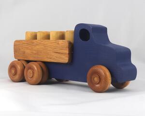 This handmade wooden Lorry truck is finished with navy blue acrylic paint and Amber Shellac. It is one of five towable trucks in this collection, available in many colors and unfinished. Custom Orders are welcome.