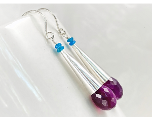 Faceted purple chalcedony teardrops topped with long sterling silver cones and blue apatite beads with sterling silver ear wires.