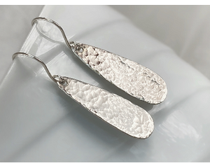 Hammered long sterling silver teardrop earrings by MariesGems.