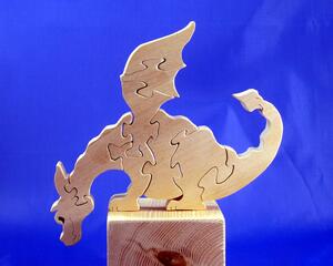 Handmade freestanding unfinished wood peaking dragon puzzle for adults or children. My toy dragon puzzles work equally well as toys or decor for your home, nursery, office, or kid's room. The puzzle is easy to assemble and stands on its own.