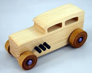 Handmade wooden toy car Hot Rod '32 Sedan finished with polyurethane, metallic purple and black trim, and nonmarring amber shellac wheels.
