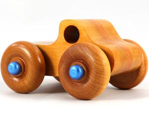 Wood Toy Monster Truck Handmade Form Hardwood and Finished With Amber Shellac With Metallic Saphire Blue Trim.
