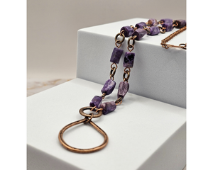 24 inch necklace featuring charoite nugget beads, linked using copper wire with a teardrop copper pendant.
