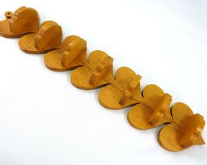 Handmade heart-shaped shelf crafted from reclaimed oak hardwood and finished with polyurethane. Perfect for displaying small items and adding rustic charm to home decor.