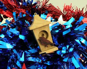 Handmade Wood Birdhouse Ornament Collectable Christmas Tree Ornament shapeed like a Christmas tree. Made from select-grade hardwoods, hand-sanded, and finished with a custom blend of oils and waxes using traditional woodworking tools.