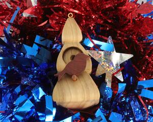 Handmade Wood Birdhouse Ornament Collectable Christmas Tree Ornament shapeed like a Christmas tree. Made from select-grade hardwoods, hand-sanded, and finished with a custom blend of oils and waxes using traditional woodworking tools.