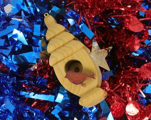 Handmade Wood Birdhouse Ornament Collectable Christmas Tree Ornament shapeed like a Christmas tree. Made from select-grade hardwoods, hand-sanded, and finished with a custom blend of oils and waxes using traditional woodworking tools.