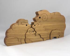 A handcrafted wood sheep family stacking puzzle features a ram, ewe,  and three lambs, all hand-finished with a blend of oils and waxes. The sheep can be used separately for pretend toys.