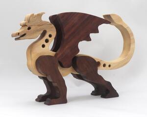 Handmade wood dragon figurine made from select grade contrasting hardwoods and hand-finished with a custom mixture of mineral oil and waxes.