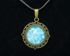 Blue and white Starburst pour painted set in bronze tone metal alloy. Fluid art pendant.
