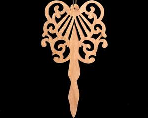 A beautiful handmade wood fretwork Christmas tree ornament in a classic Victorian icicle style. This delicate ornament is hand finished with clear shellac for a timeless look. It is the perfect addition to any Christmas tree collection.