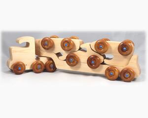 Handmade wooden toy truck play set includes three cars and a tractor-trailer finished with clear and amber shellac with metallic sapphire blue trim.