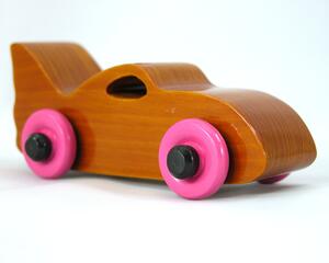 Handmade wooden toy bat car finished with amber shellac and trimmed with pink and black paint. Made to Order. Other colors are available.