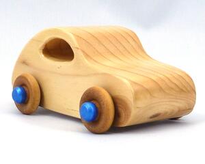 Handmade wood toy car based on the 1957 Bug with a satin polyurethane finish, metallic sapphire blue trim, and nonmarring amber shellac wheels. Made to Order.