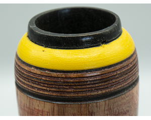 This vase with a golden ring is a nice amphora burned on the lines at the top, maximizing its color and beautiful wood. Oil Coated.