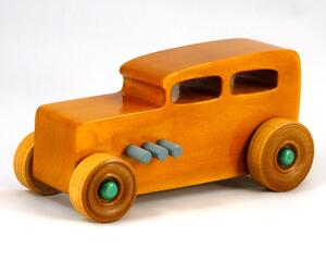 Handmade wooden toy car - Classic '32 Sedan, finished with amber shellac, metallic emerald green and gray acrylic paint, and non-marring amber shellac.