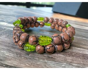 Wood memory wire bracelet with glass leaves.