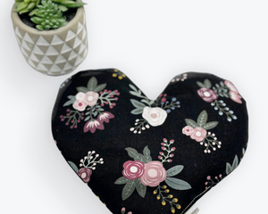 Black fabric with white and pink flowers heart shaped eye pillow