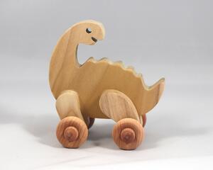 Handmade wooden push toy dinosaur made from select grade hardwoods and finished with a non-toxic coating.