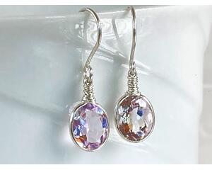Faceted lavender amethyst gemstone earrings bezel set in sterling silver with wire wrapped accents and sterling silver ear wires.