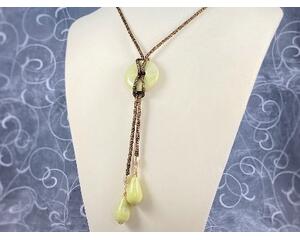 Peridot jasper donut pendant and teardrop tassels with bronze SilverSilk knitted wire chain.