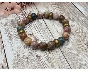 African opal stretch bracelet, not a true opal but a type of jasper resembling opal with pink to green hues and matrix pattern.