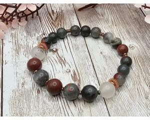 7 inch stretch bracelet comprised of African bloodstone beads, which is a deep, earthy green, often with varying shades and intensity.