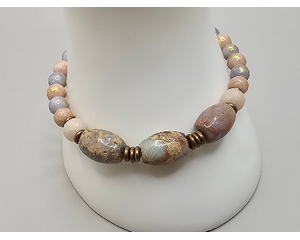 7.5 in adjustable length bracelet features impression jasper, gold dusted dyed jade beads, crystal rondelles, brass accents, vintage chain.