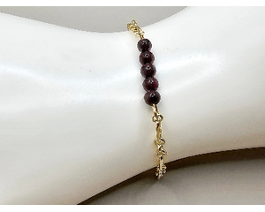 Dainty adjustable length 8 inch bracelet with tiny garnet beads and gold plated chain and handcrafted 14k gold filled wire hook clasp.