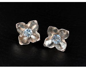 Prong-set blue topaz studs with sterling silver tulip cup earrings jackets by MariesGems.