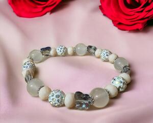 Pink stretch bracelet. This is very pretty Beads all kinds sizes and shapes.