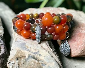 Glass and ceramic beads with two different leaf charms on a memory wire. Just beautiful!