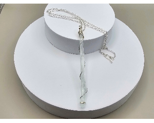 19 inch necklace featuring a 4 inch clear recycled glass piece gifted to me by a friend, wrapped with wire and hung on silver plated chain.
