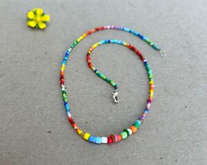 ​Bright, colorful, happy beaded necklace, perfect for spring and summer. 17in, silver tone lobster clasp.