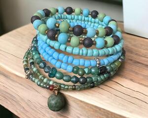 This is a pretty blue green memory wire bracelet, that wraps around the wrist 7 times.