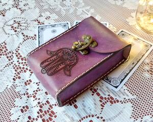 This Premium Handmade Leather Tarot Card Case features a a Hamsa Hand symbol. The Tarot Card Box has been hand crafted, hand dyed and hand sewn in our shop. The leather Tarot Deck Holder is dyed in a color called Violet Cosmos which includes many purple and violet tones
