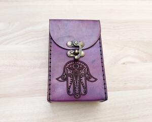 This Premium Handmade Leather Tarot Card Case features a a Hamsa Hand symbol. The Tarot Card Box has been hand crafted, hand dyed and hand sewn in our shop. The leather Tarot Deck Holder is dyed in a color called Violet Cosmos which includes many purple and violet tones.