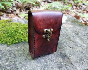 This Premium Handmade Leather Tarot Card Case is individually hand dyed to mimic molten rock - Brimstone is a whirl of Blacks, Grays, and Reds all molten together to create a unique deep red color.