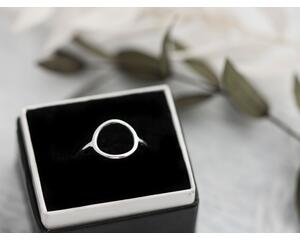 Sterling silver ring with an open circle top.